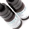 Vue plongeante sur les bouchons pipette de deux flacons d'huile CBD+CBG Full Spectrum MONPLANCBD - Gouttes CBD CBG.